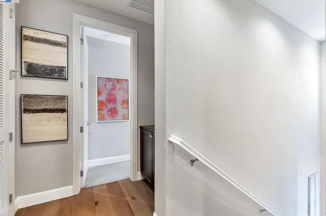 a view of front door with wooden floor