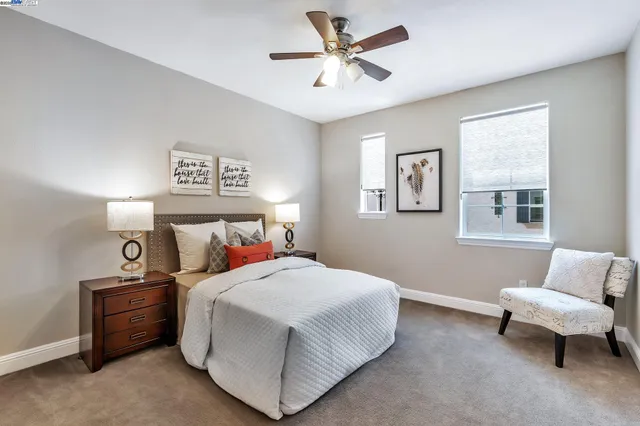 a bedroom with a bed and a couch