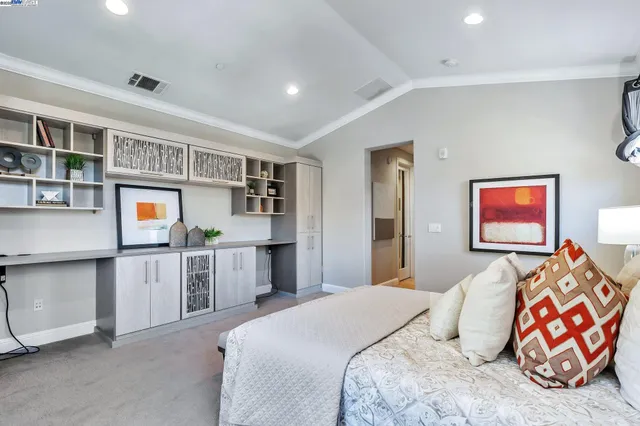 a bedroom with furniture and window