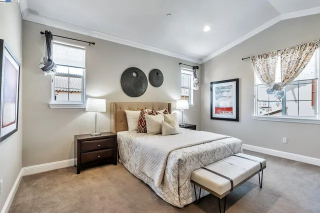 a bedroom with bed and a window