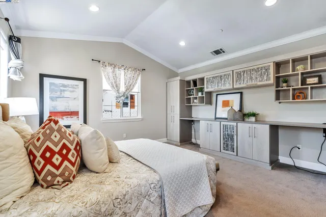 a bedroom with bed and window