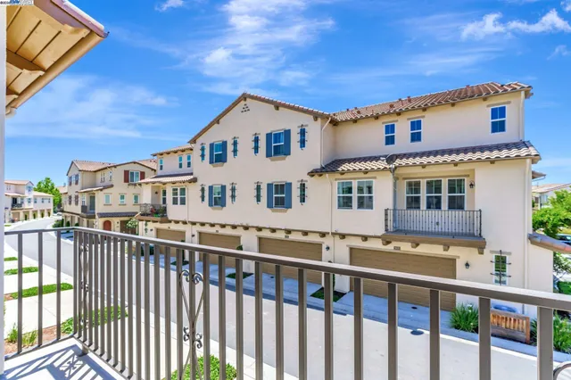 a view of a white building among the deck