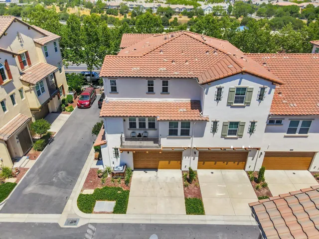 a aerial view of a house with swimming pool