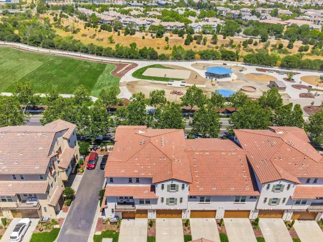 an aerial view of residential houses and outdoor space