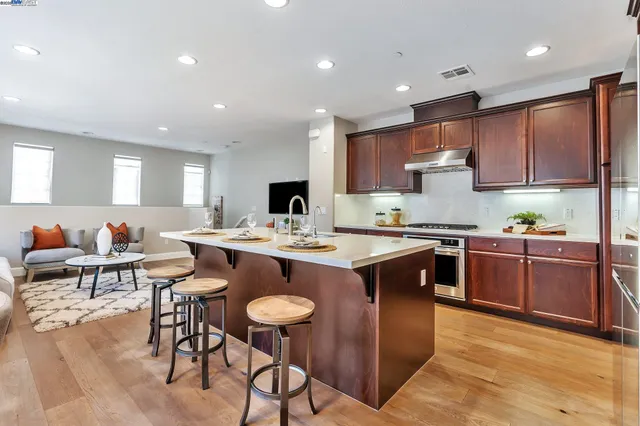 a large kitchen with a table and chairs in it