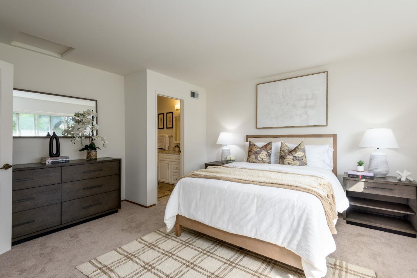 1029 Suzanne Court Half Moon Bay, CA 94019 - Photo 12 of 25 a bedroom with a bed and a mirror on dresser