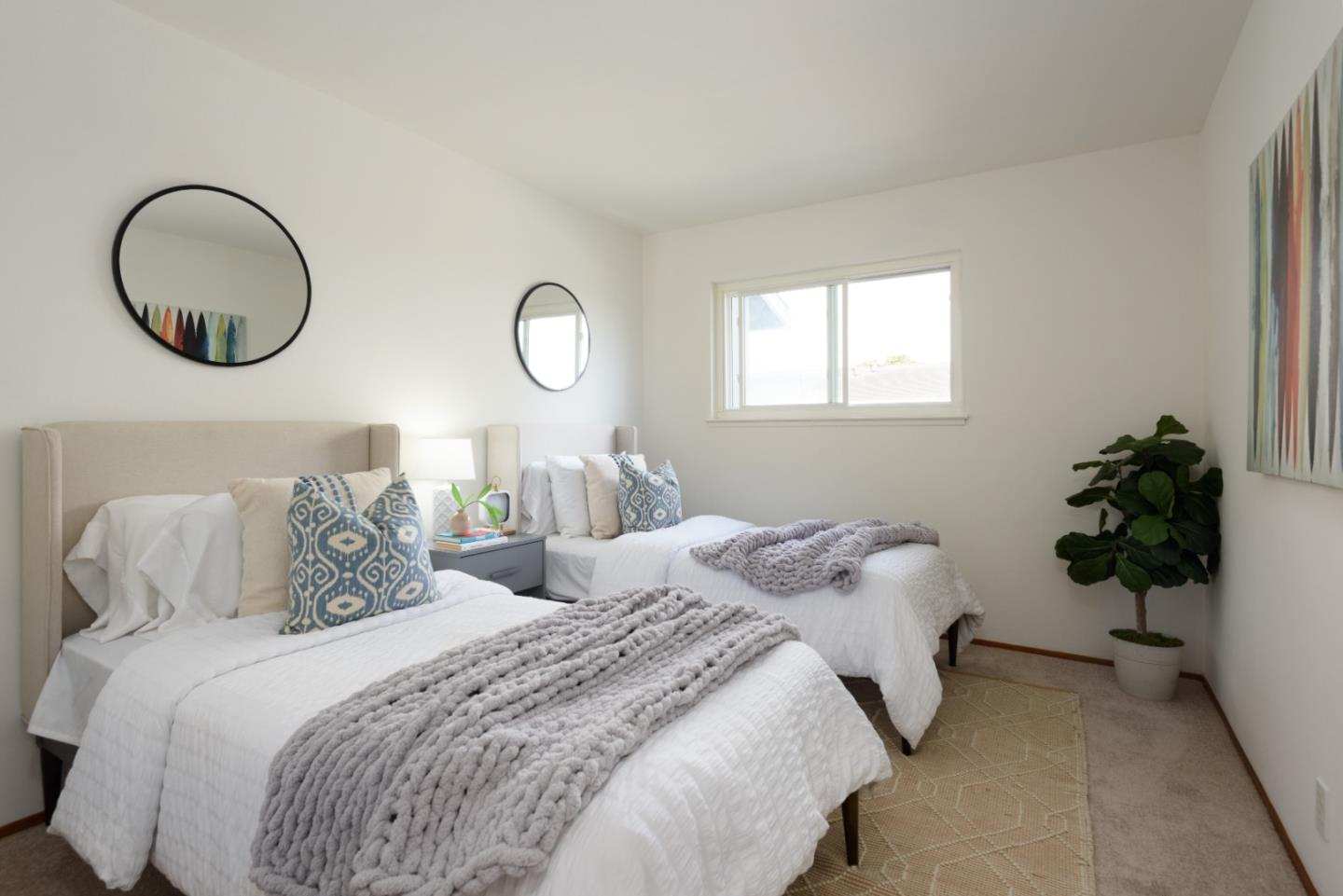 1029 Suzanne Court Half Moon Bay, CA 94019 - Photo 14 of 25 a bedroom with a bed and a chandelier