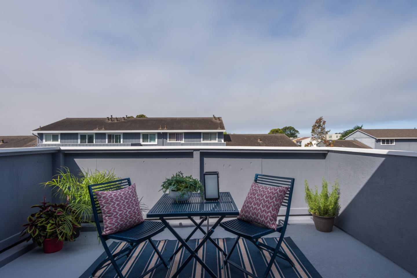 1029 Suzanne Court Half Moon Bay, CA 94019 - Photo 16 of 25 a view of table and chair with potted plants