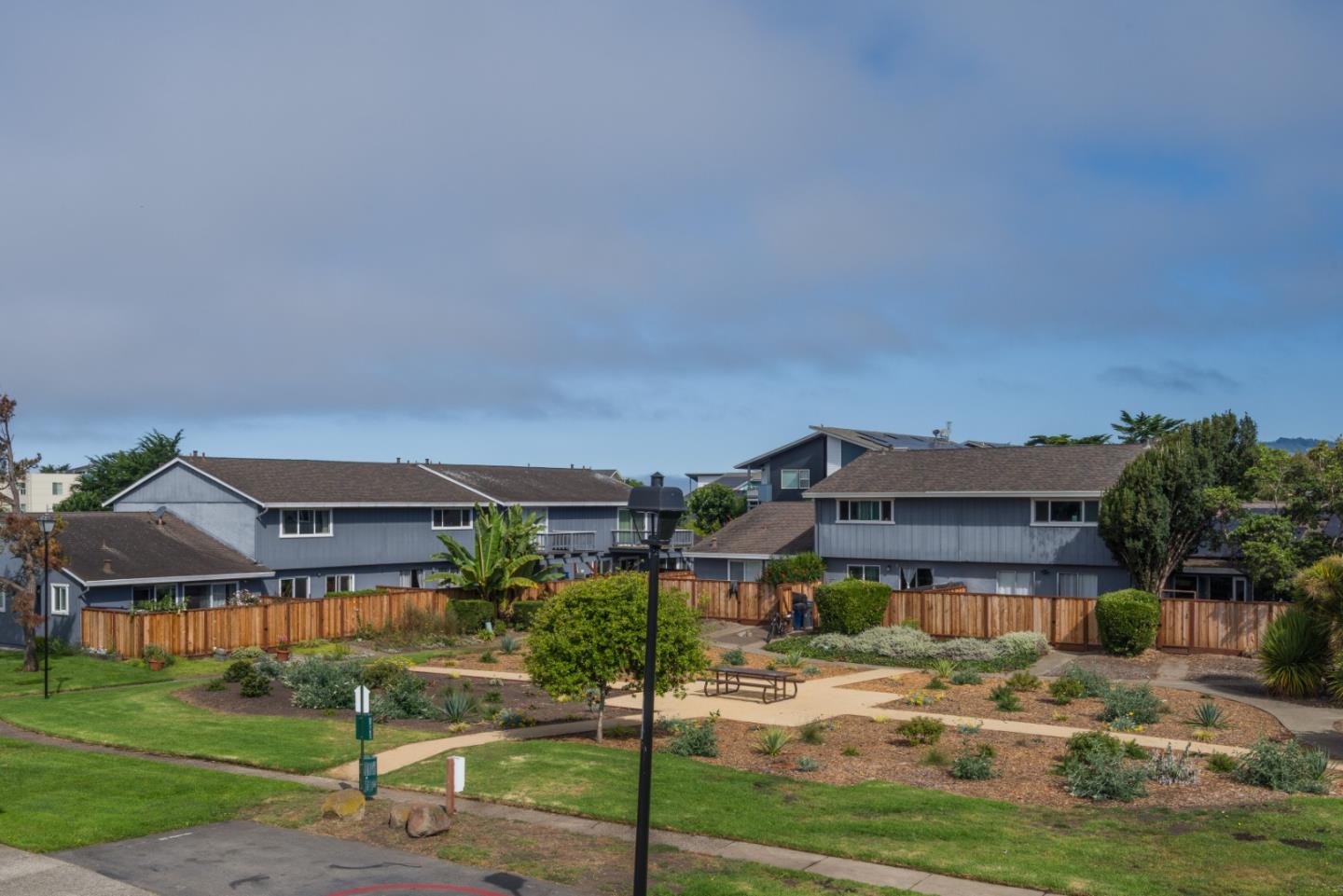 1029 Suzanne Court Half Moon Bay, CA 94019 - Photo 17 of 25 a front view of a house with a yard
