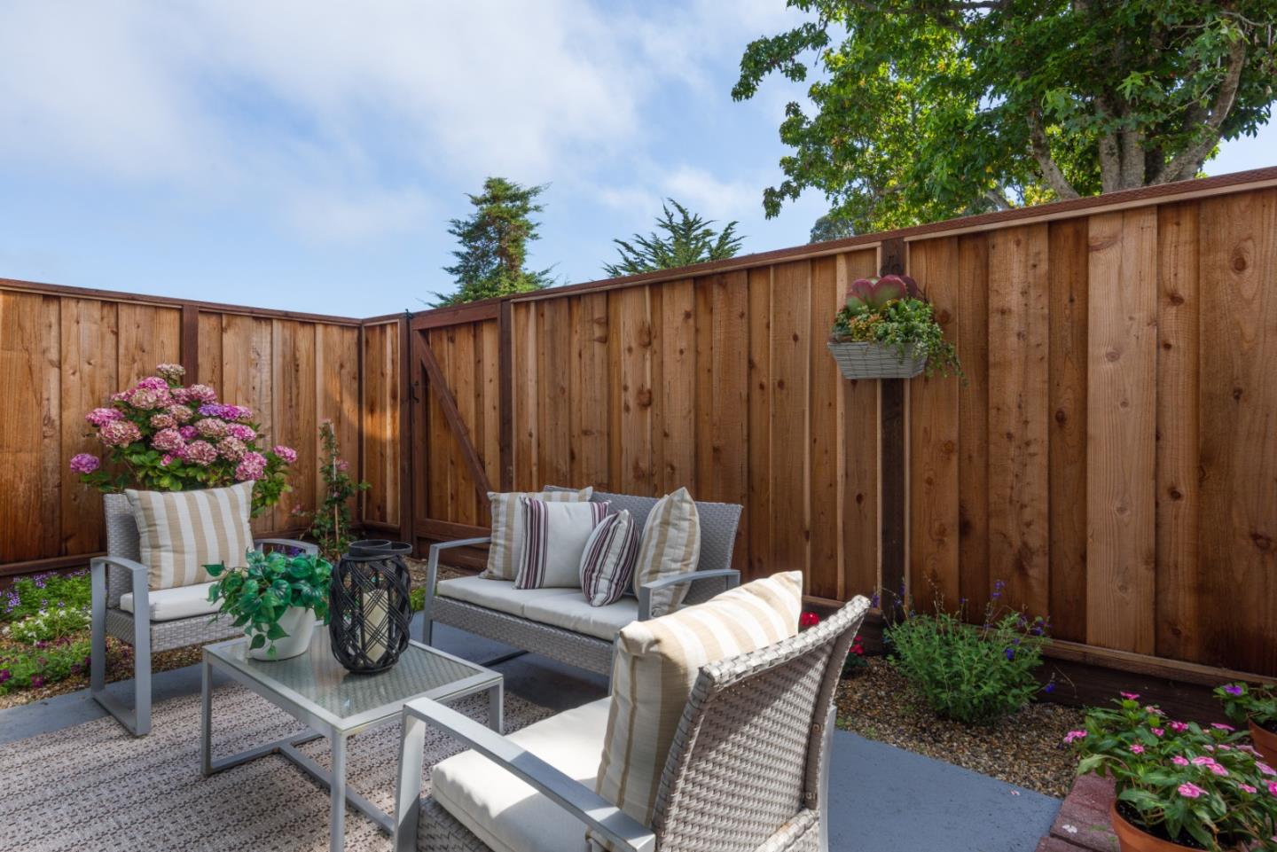1029 Suzanne Court Half Moon Bay, CA 94019 - Photo 18 of 25 a view of a backyard with a chair and potted plants