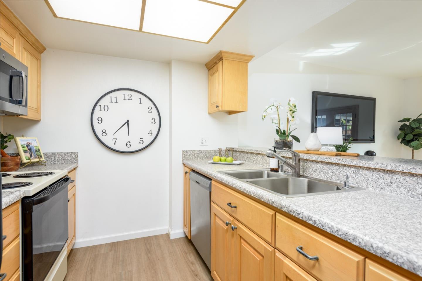 1029 Suzanne Court Half Moon Bay, CA 94019 - Photo 5 of 25 a spacious bathroom with a granite countertop sink and a mirror