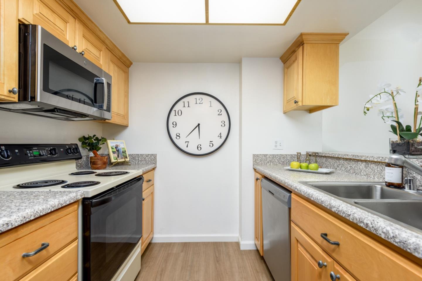 1029 Suzanne Court Half Moon Bay, CA 94019 - Photo 6 of 25 a kitchen with stainless steel appliances granite countertop a sink a stove and cabinets