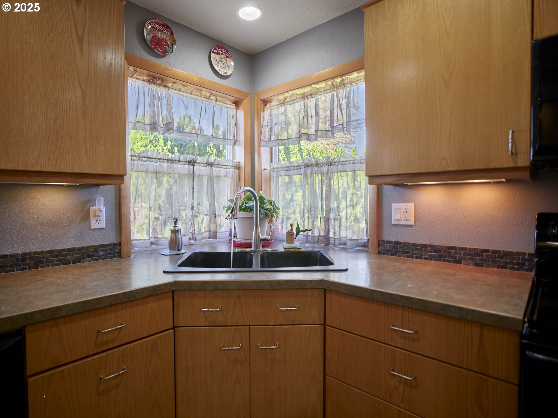 115 Whalen Loop Road Woodland, WA 98674 - Photo 11 of 40 a kitchen with stainless steel appliances granite countertop a sink and a window