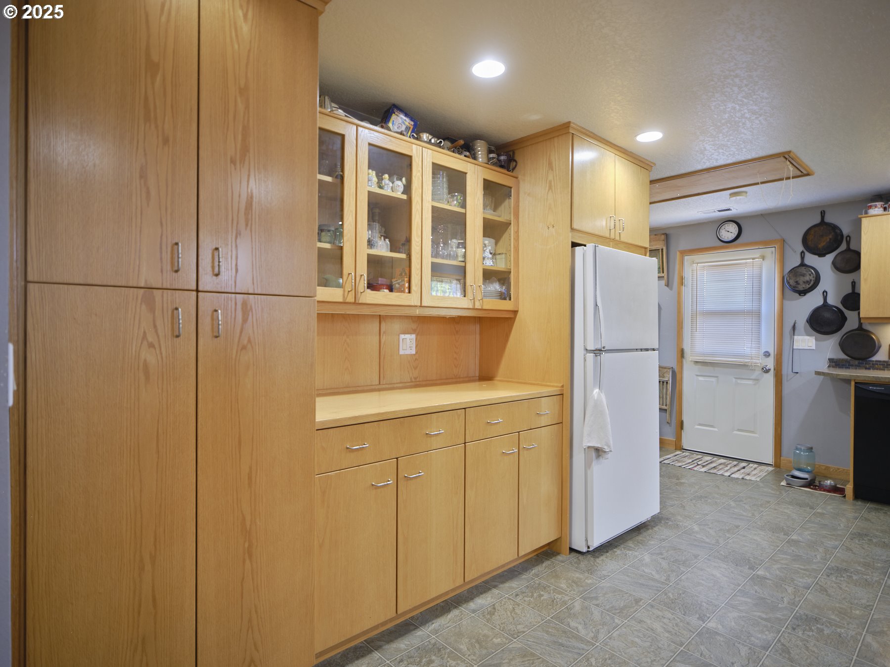 115 Whalen Loop Road Woodland, WA 98674 - Photo 12 of 40 a kitchen with refrigerator and window