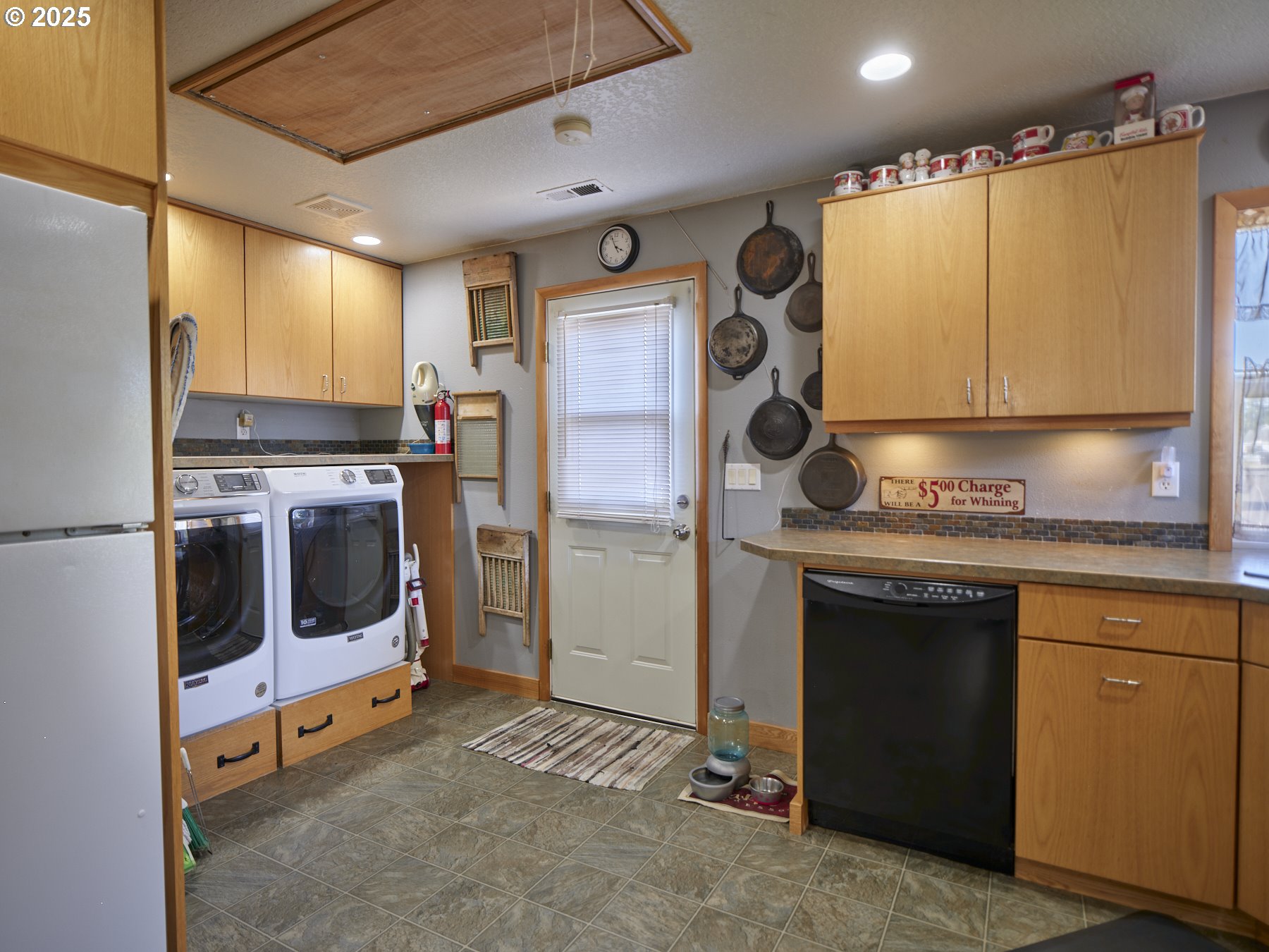 115 Whalen Loop Road Woodland, WA 98674 - Photo 13 of 40 a kitchen with stainless steel appliances granite countertop a stove a refrigerator and a microwave