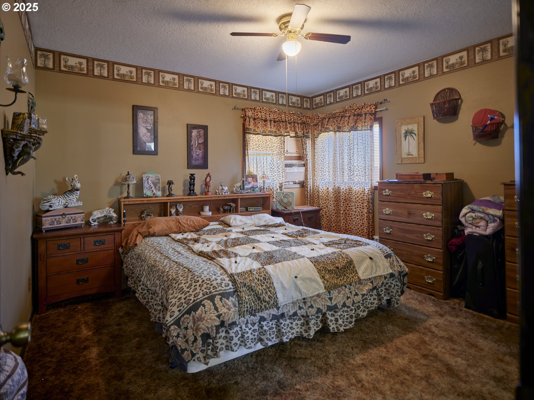 115 Whalen Loop Road Woodland, WA 98674 - Photo 19 of 40 a bedroom with a bed and a chandelier