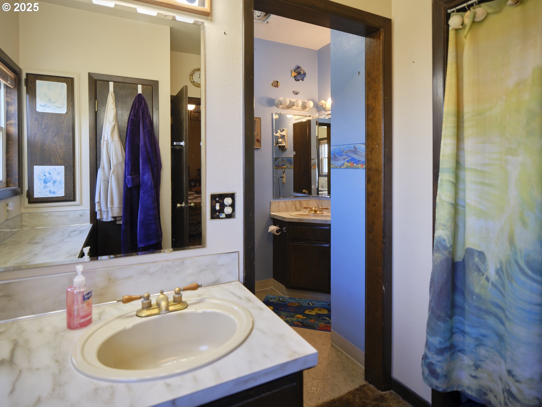115 Whalen Loop Road Woodland, WA 98674 - Photo 21 of 40 a bathroom with a sink and a mirror