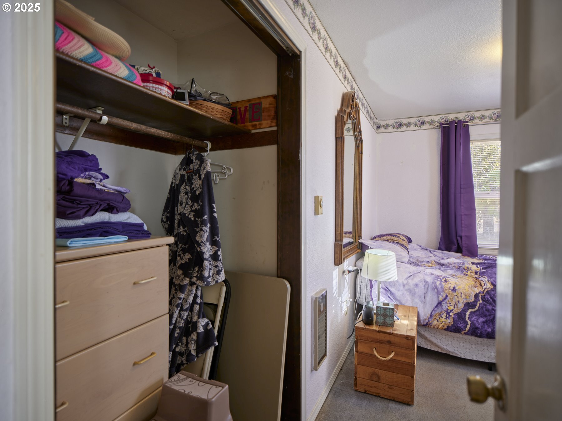 115 Whalen Loop Road Woodland, WA 98674 - Photo 25 of 40 a bedroom with a bed and a window