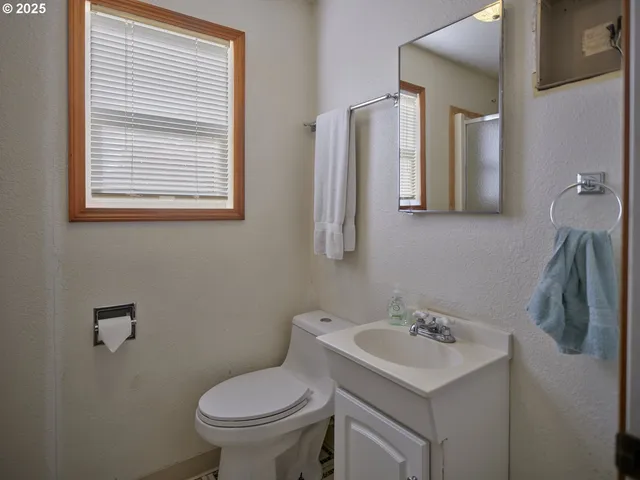 a view of empty room with wooden walls