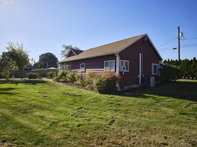 a view of a park with large trees