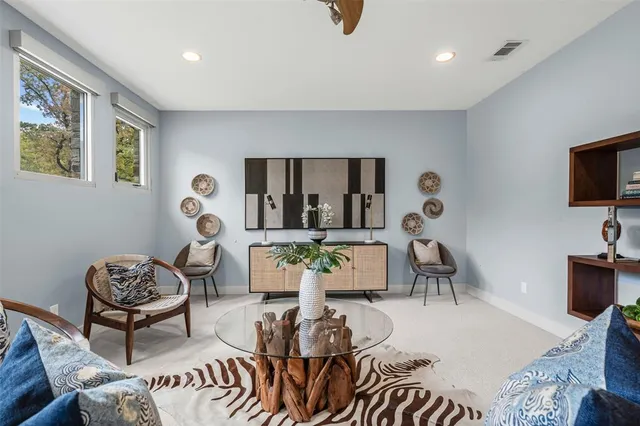 a living room with furniture and a large window