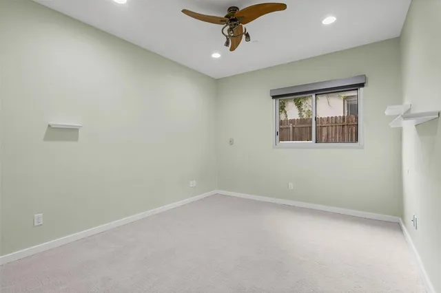 a bathroom with a granite countertop sink a mirror and a shower
