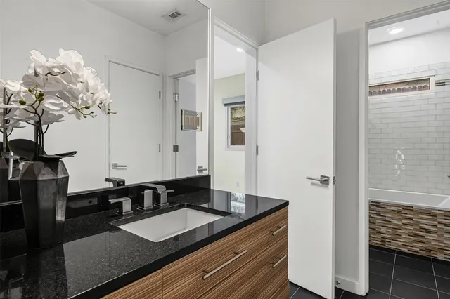 a bathroom with a bathtub and a toilet
