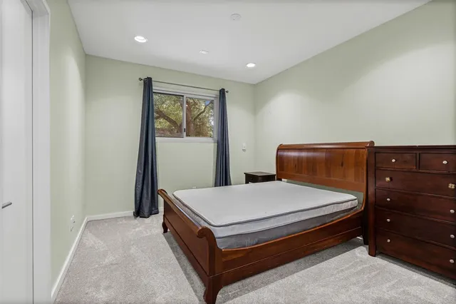 a lobby with a fireplace and a flat screen tv