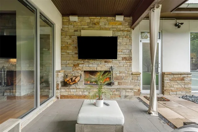 a kitchen with stainless steel appliances kitchen island granite countertop a stove a sink and white cabinets