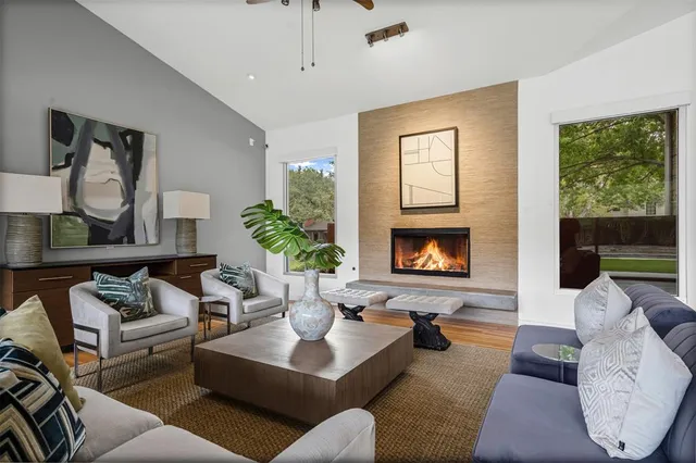 a living room with furniture and a fireplace