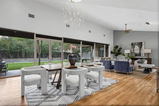 a kitchen with stainless steel appliances granite countertop a stove and white cabinets