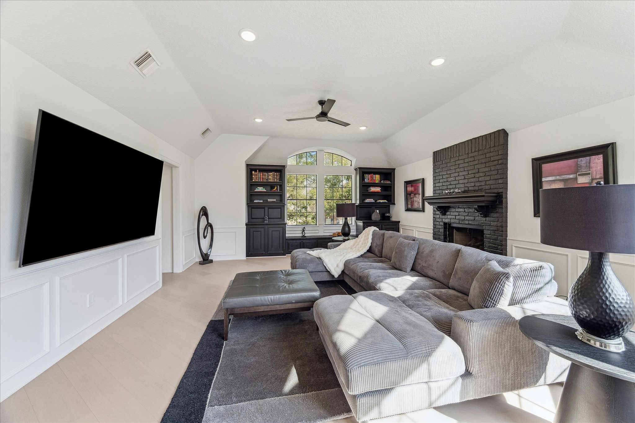 6787 Monarda Court Houston, TX 77069 - Photo 16 of 33 a living room with furniture and a flat screen tv