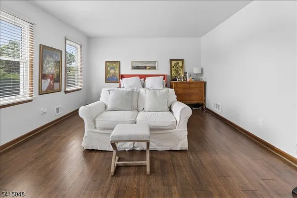 a view of a yard with snow on the road