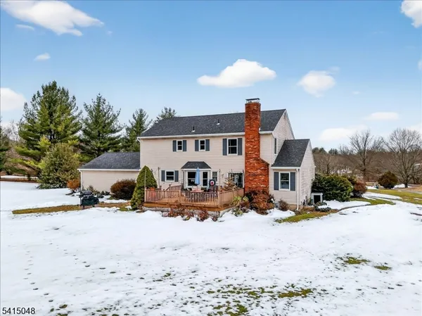 a view of a house with a snow on the road