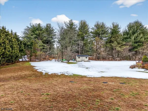 a view of yard covered with snow