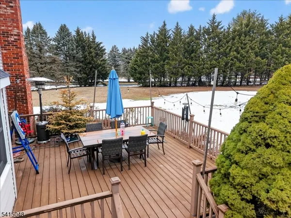 a view of entryway with wooden floor and stairs