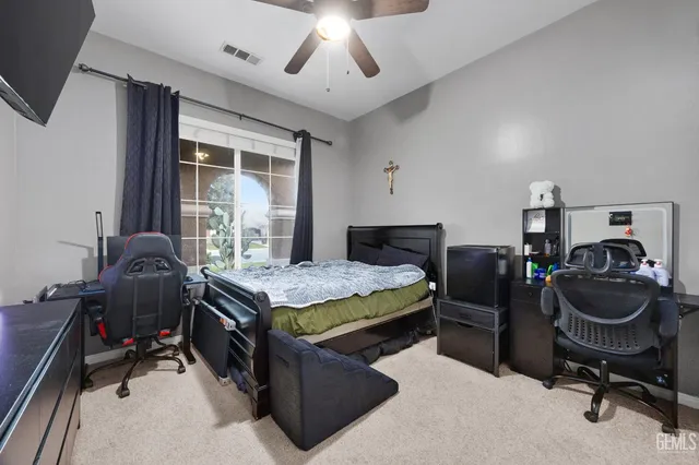 a bedroom with a bed and window