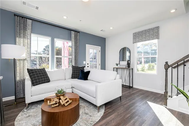 a living room with furniture and a large window