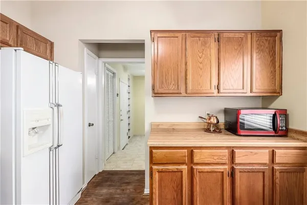 a kitchen with stainless steel appliances granite countertop a sink and refrigerator