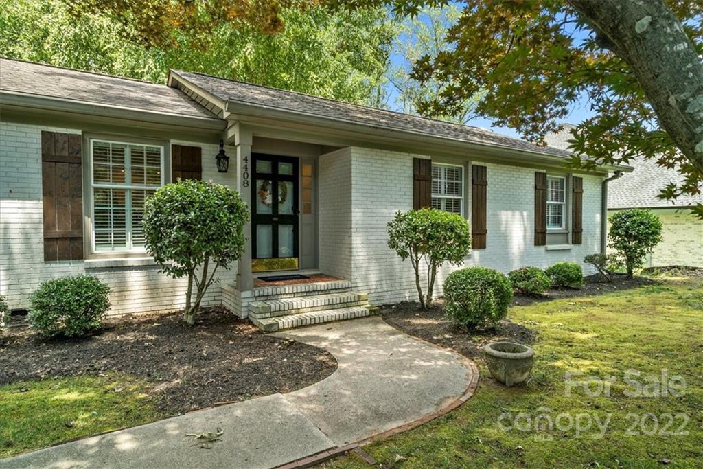 a view of house with yard and outdoor space