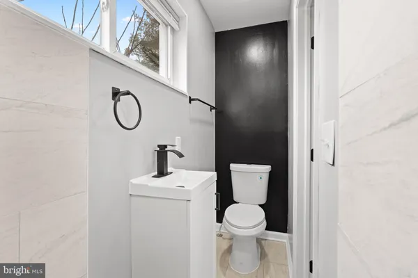 a bathroom with a toilet and a sink
