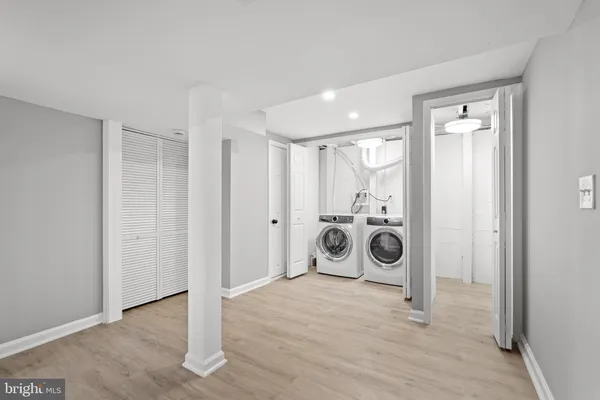 a view of a storage & utility room with washer and dryer