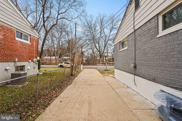 a view of a brick house with a yard