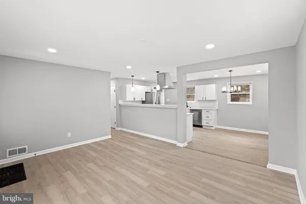 a view of kitchen with wooden floor