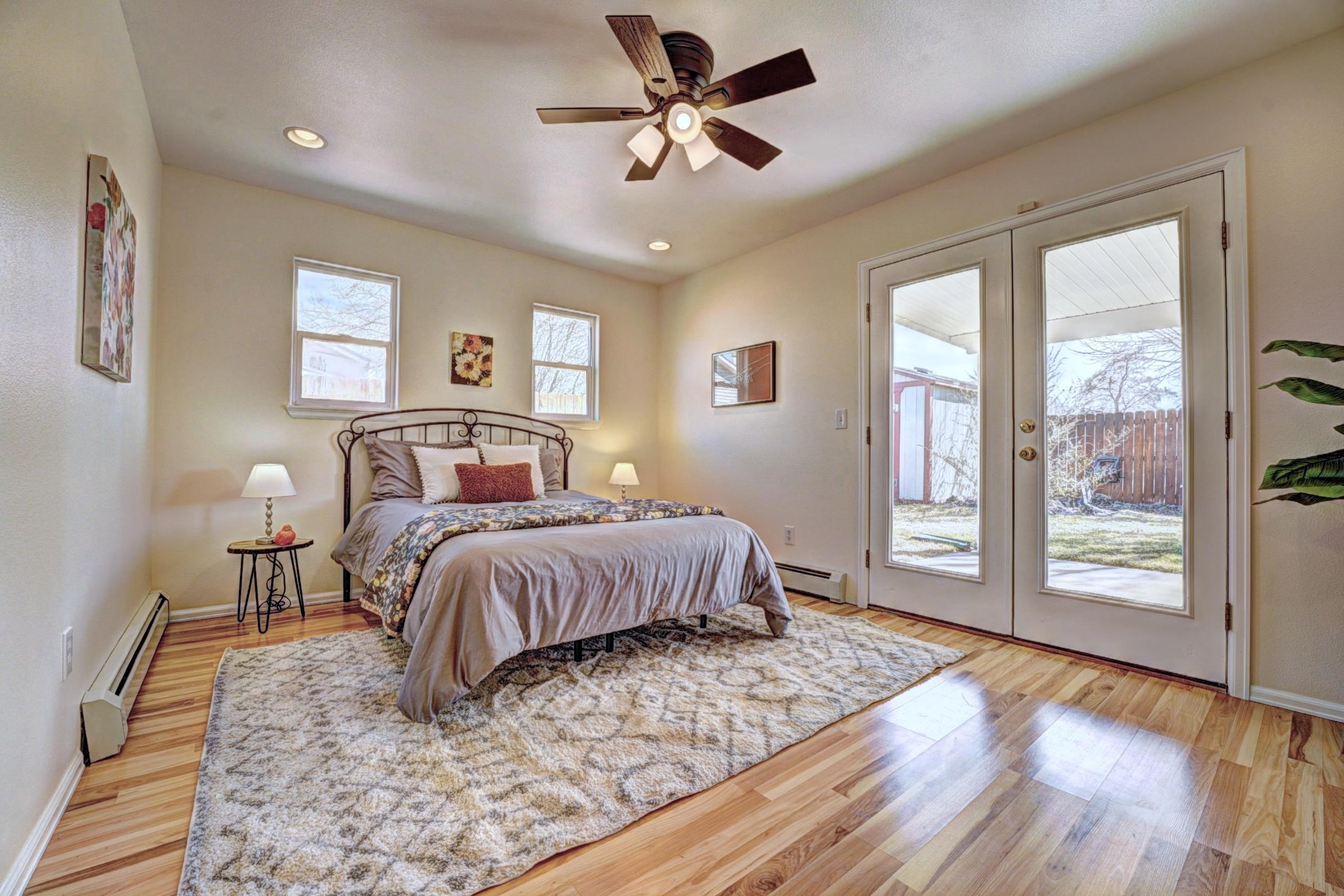 1460 Powell Street Fruita, CO 81521 - Photo 19 of 35 a bedroom with a large bed and a window