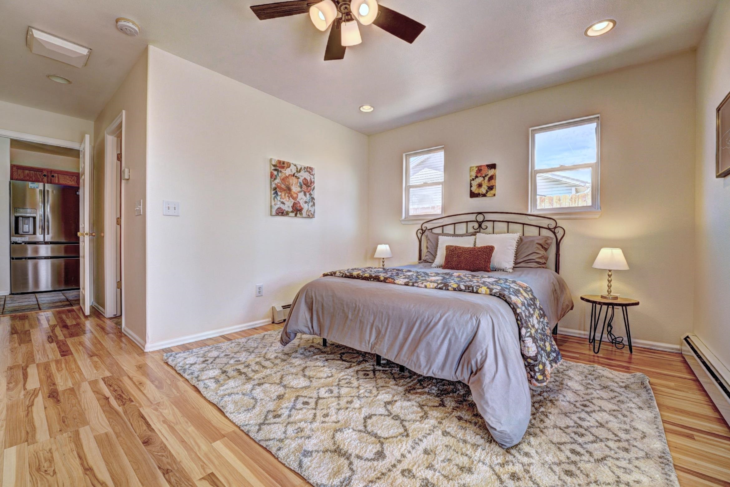 1460 Powell Street Fruita, CO 81521 - Photo 20 of 35 a bedroom with a bed and wooden floor