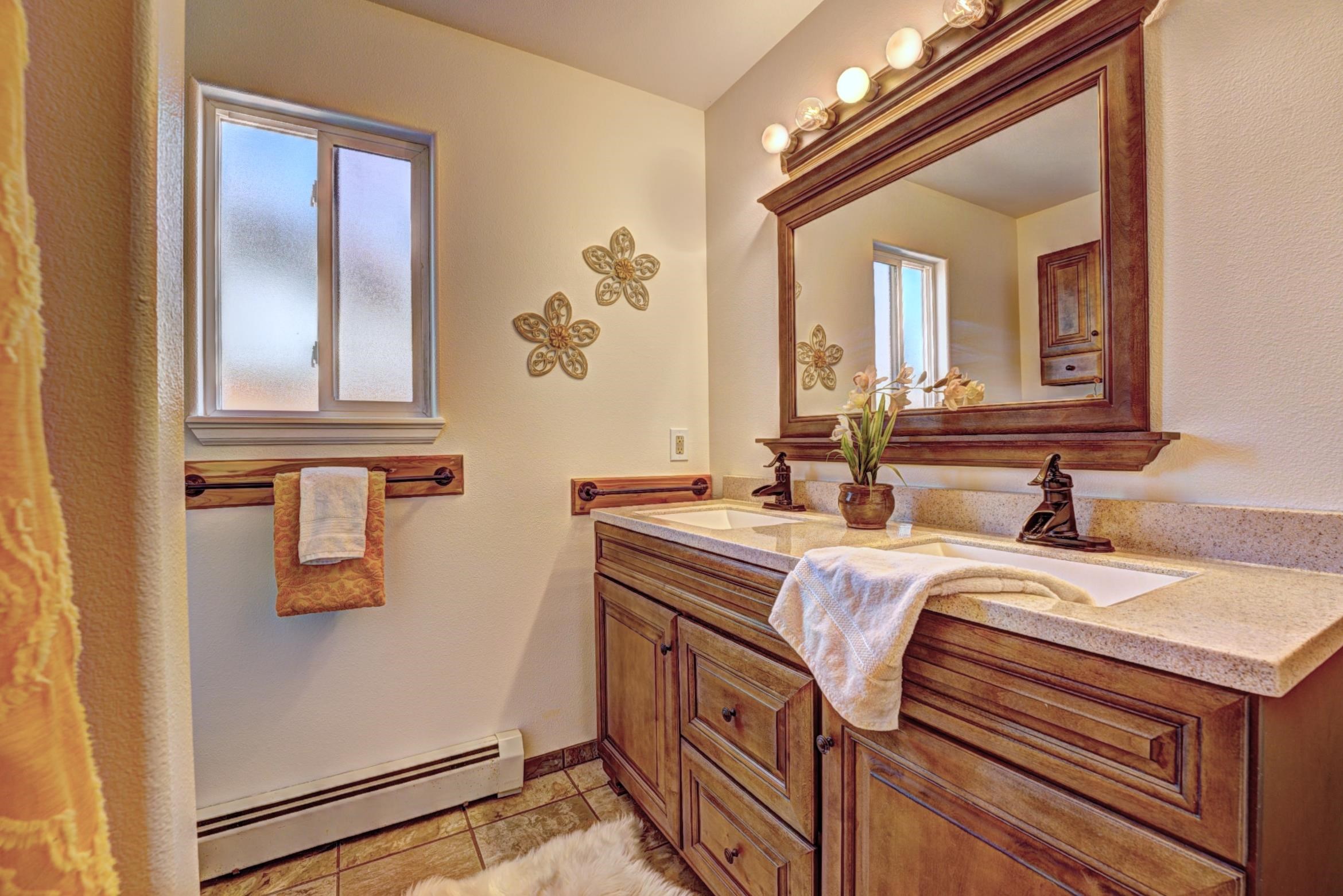 1460 Powell Street Fruita, CO 81521 - Photo 23 of 35 a bathroom with a sink and a mirror