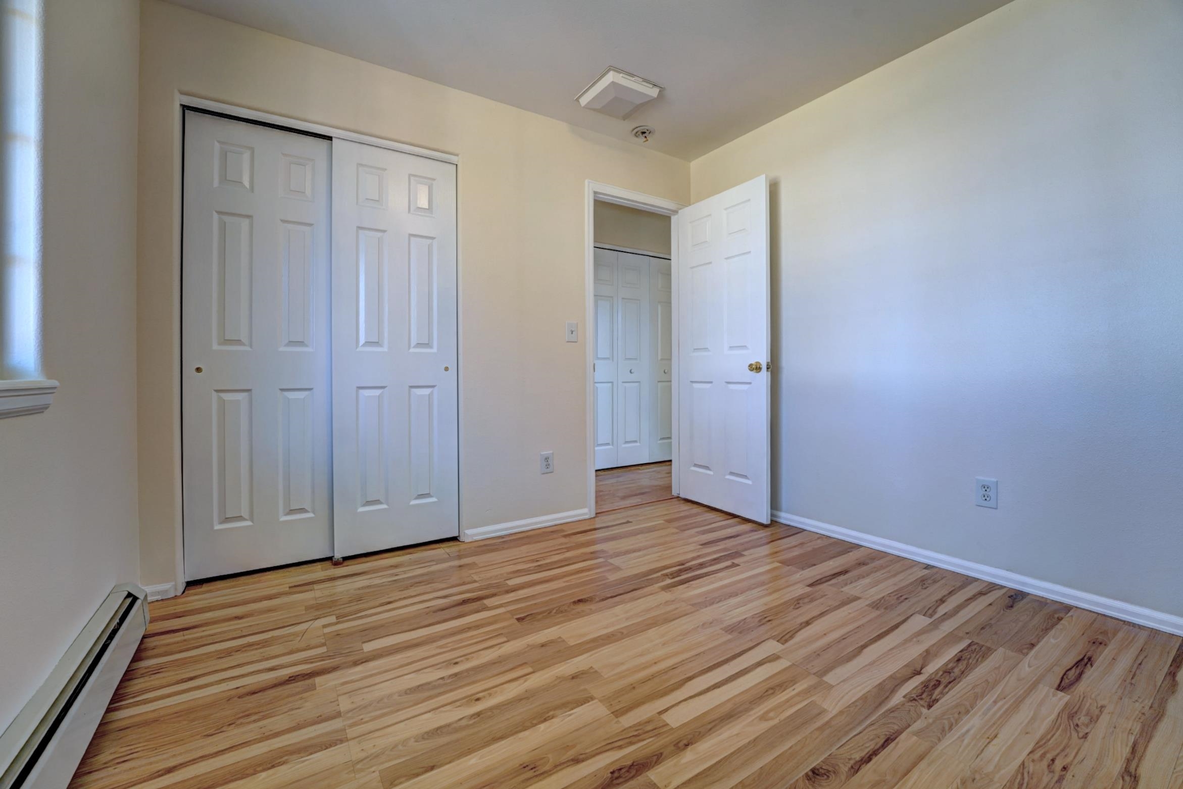 1460 Powell Street Fruita, CO 81521 - Photo 26 of 35 a view of an empty room with wooden floor