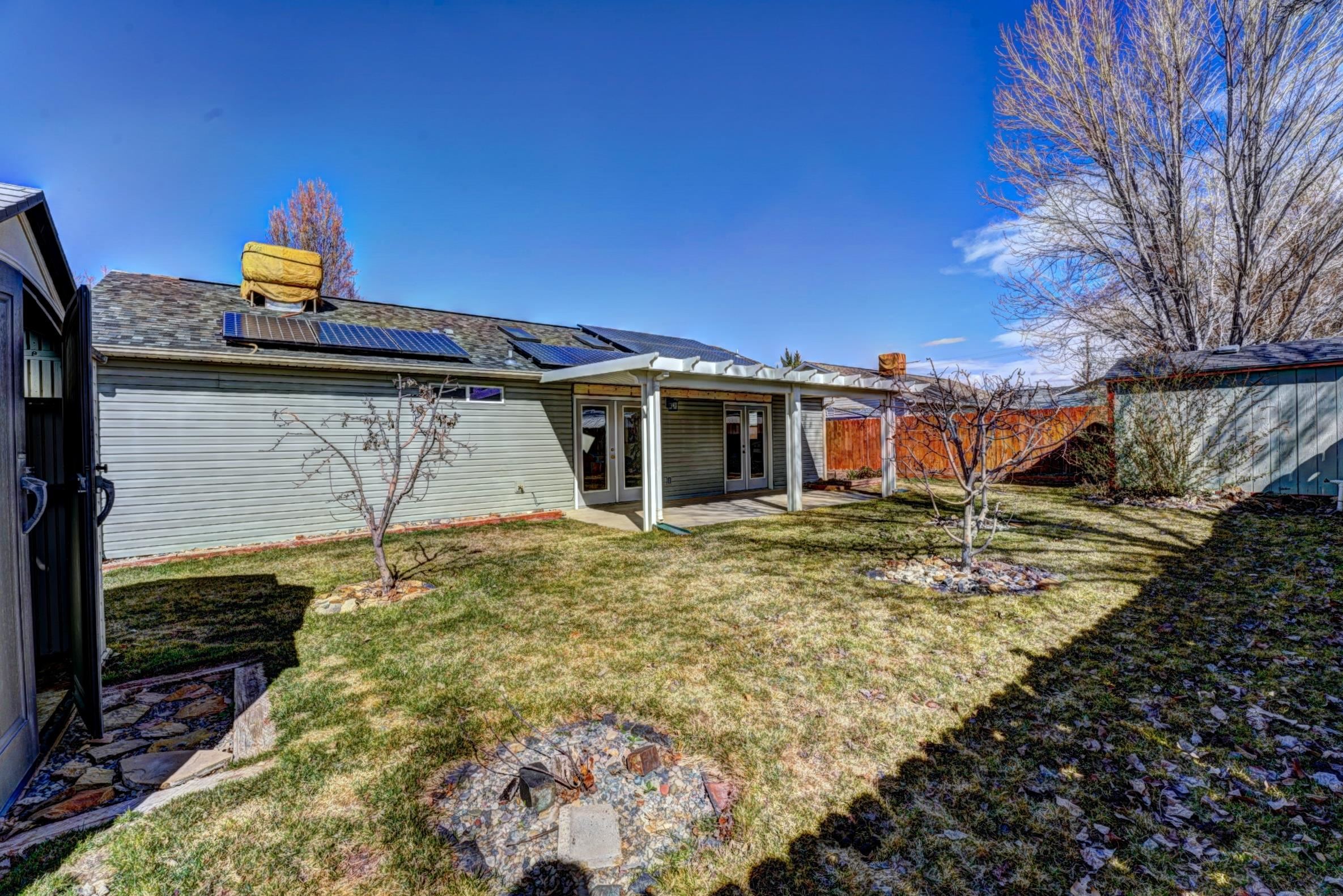 1460 Powell Street Fruita, CO 81521 - Photo 32 of 35 a front view of a house with garden