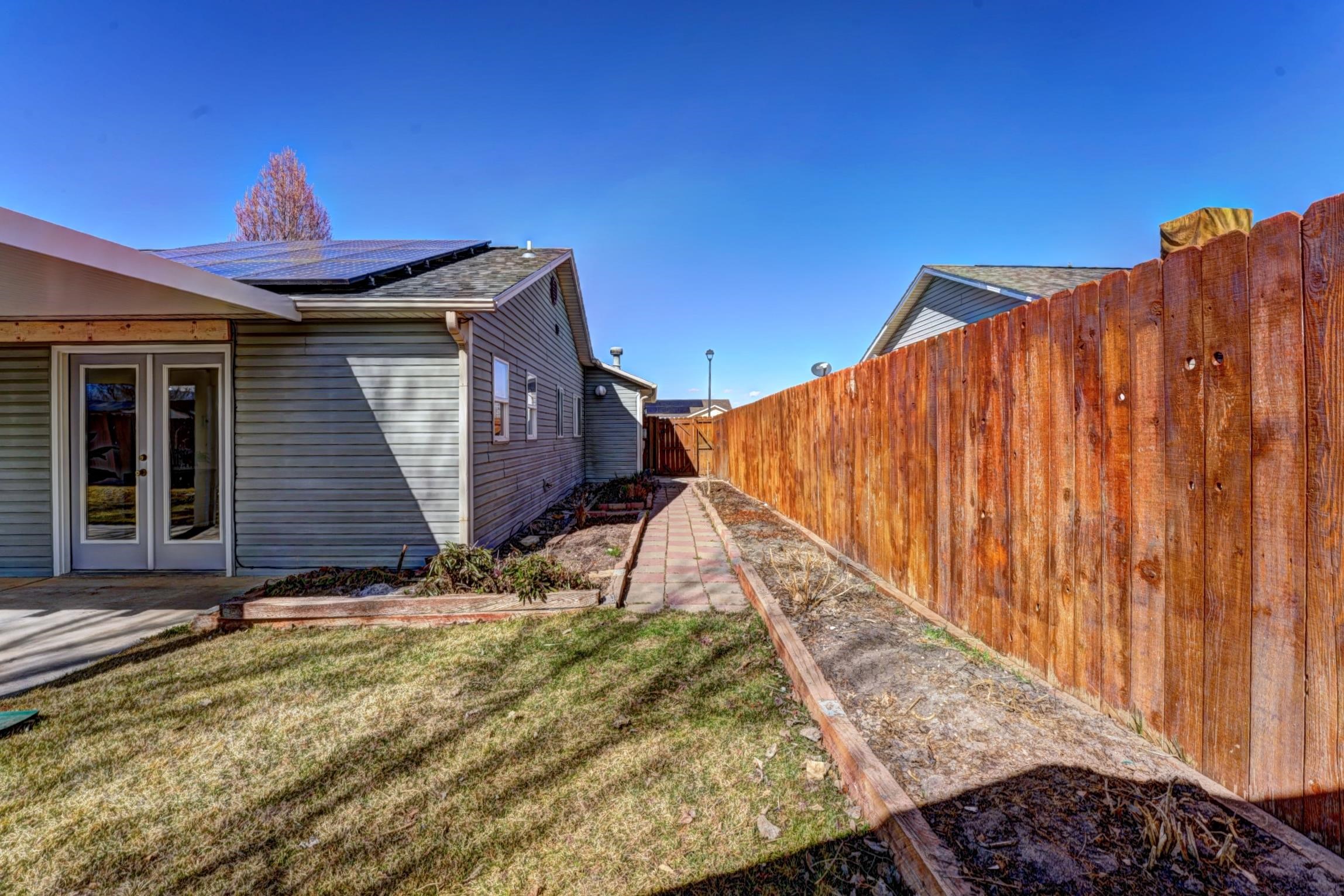 1460 Powell Street Fruita, CO 81521 - Photo 33 of 35 a view of a backyard with a small cabin